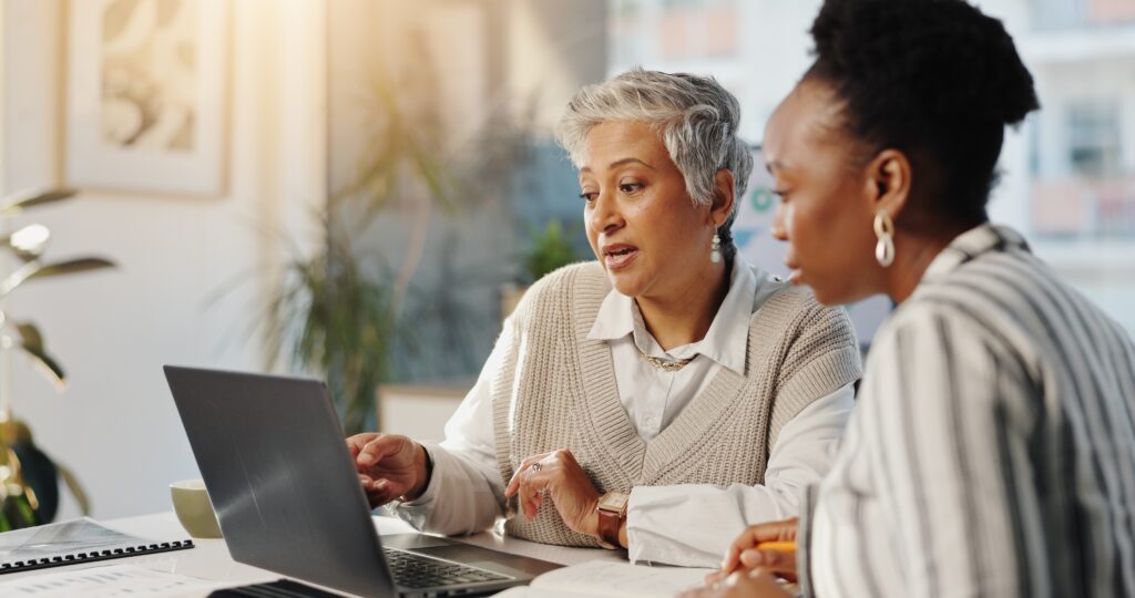 Tax professional reviewing a year-round tax planning strategy with a client instead of relying only on DIY tax filing software.