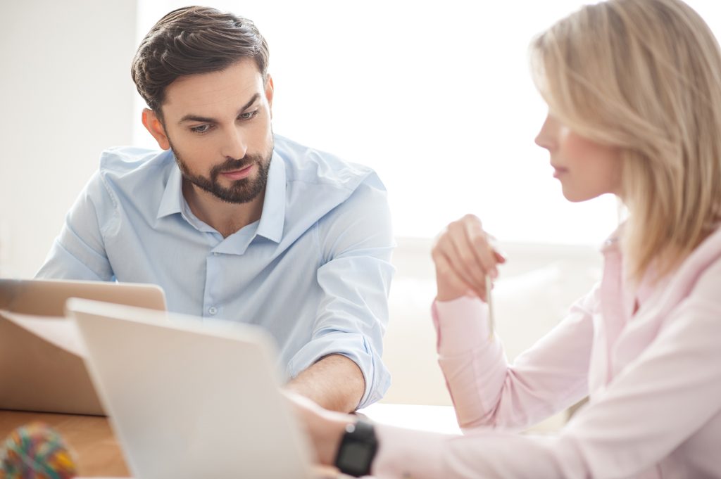 Taxpayer reviewing an IRS notice and response deadline with a tax professional to understand the letter and next steps.