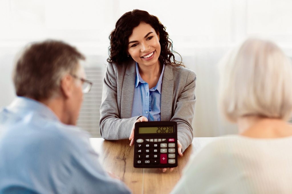 Taxpayer comparing the five IRS filing statuses and 2026 standard deductions with a professional tax planner