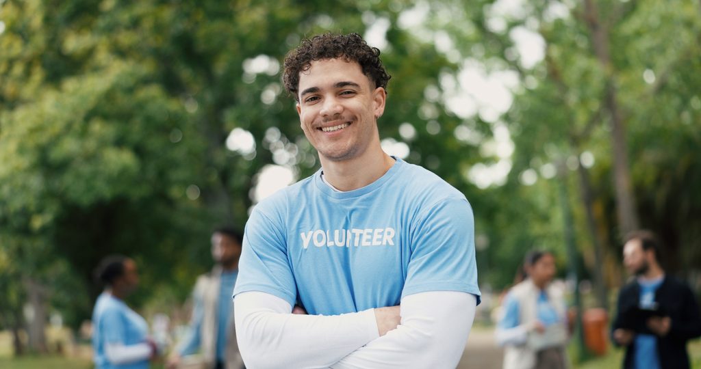 Volunteer supporting a charitable organization, highlighting potential tax benefits of charitable donations
